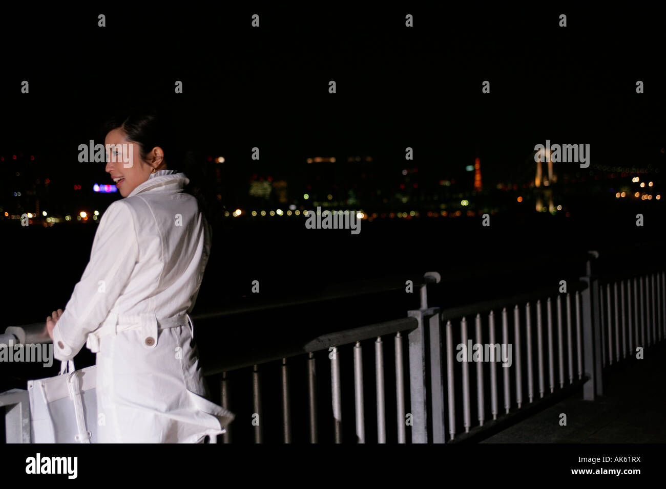 Woman alone night rear view hi-res stock photography and images - Alamy