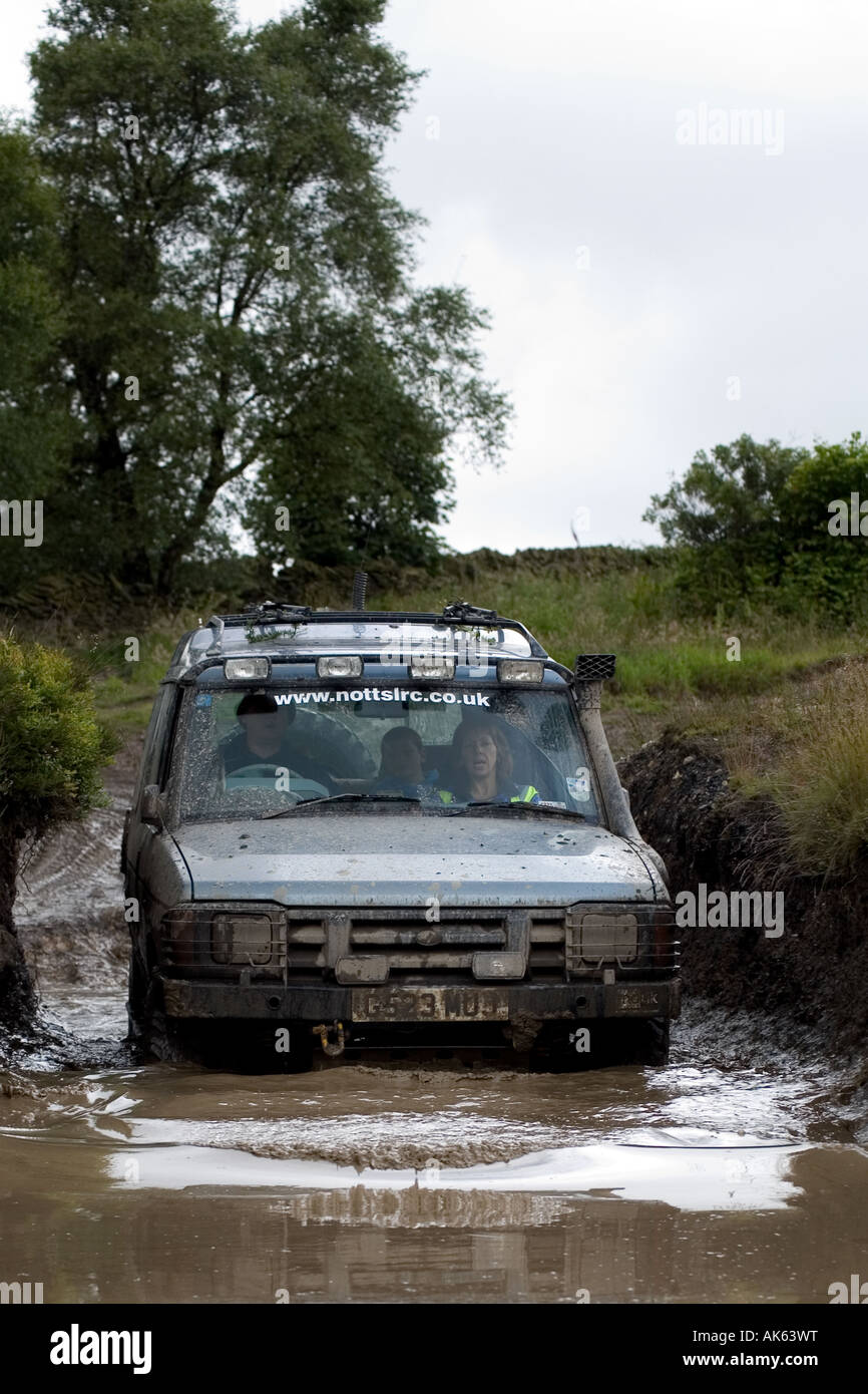 Land Rover Discovery fording muddy water Stock Photo - Alamy
