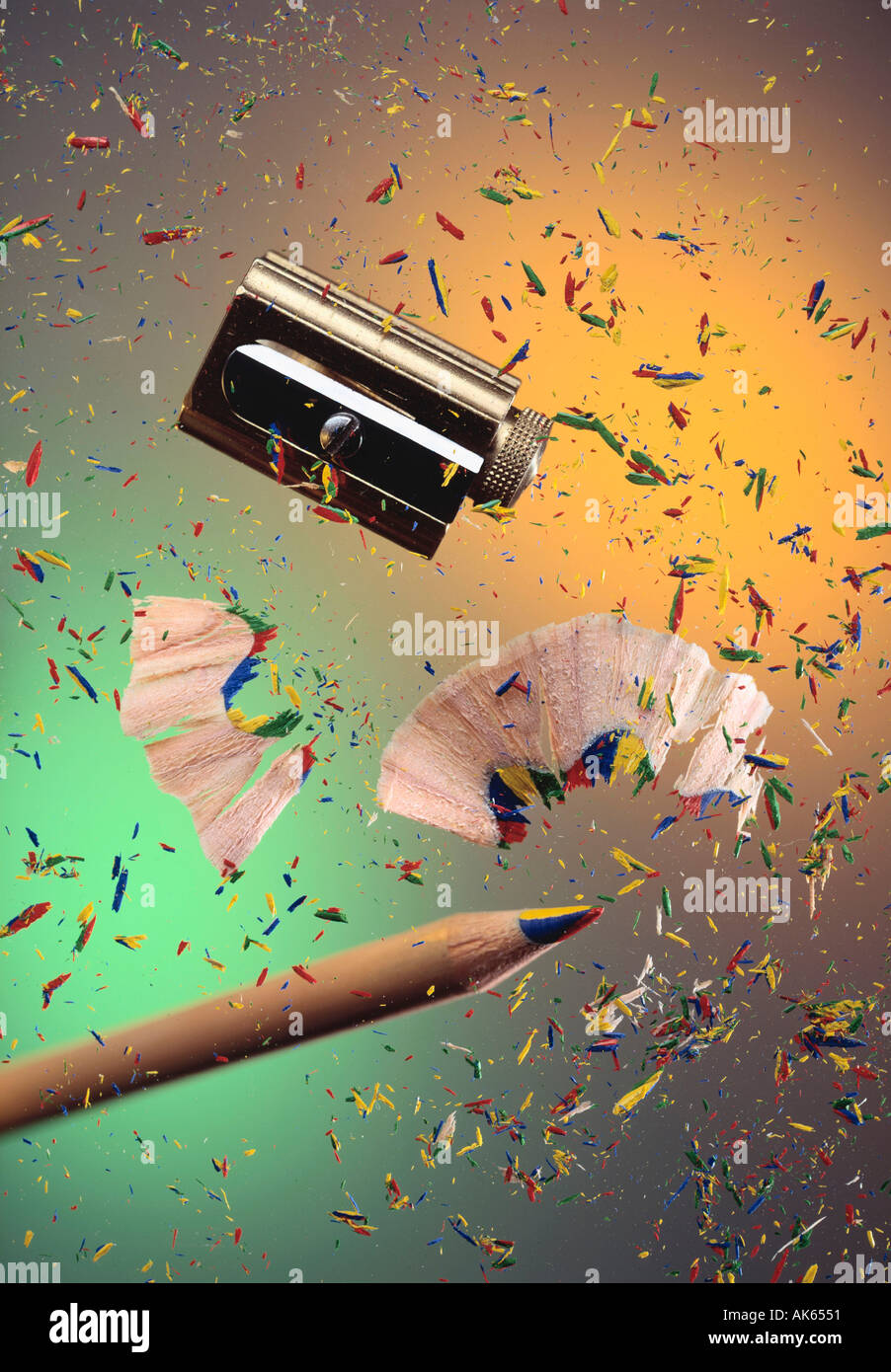 Colored pencil sharpener and shavings Buntstift Anspitzer und Spaene crayon coloured pencil Hochformat vertical Stock Photo