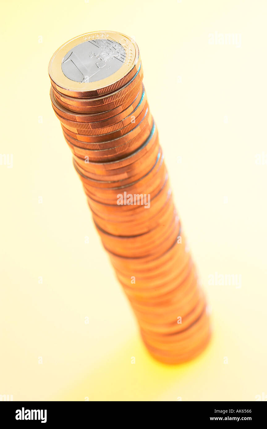 Pile of one euro coins Stapel mit Ein Euro Muenzen Muenze Freisteller cut out Objekt object Saeule column Hochformat vertical Stock Photo