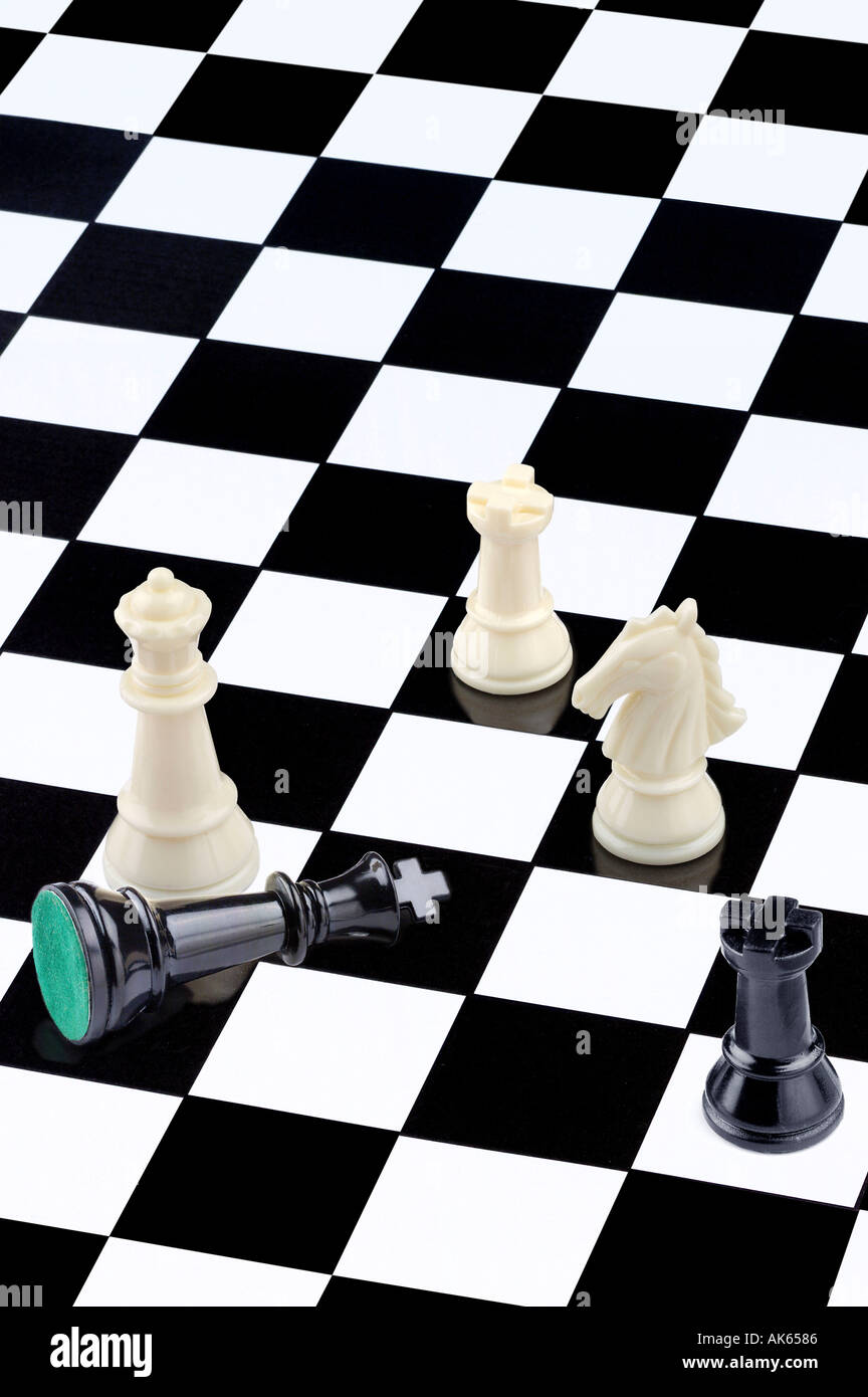 Chessmen on chessboard Schachfiguren auf Schachbrett schwarz weiss black white Hochformat vertical Stock Photo