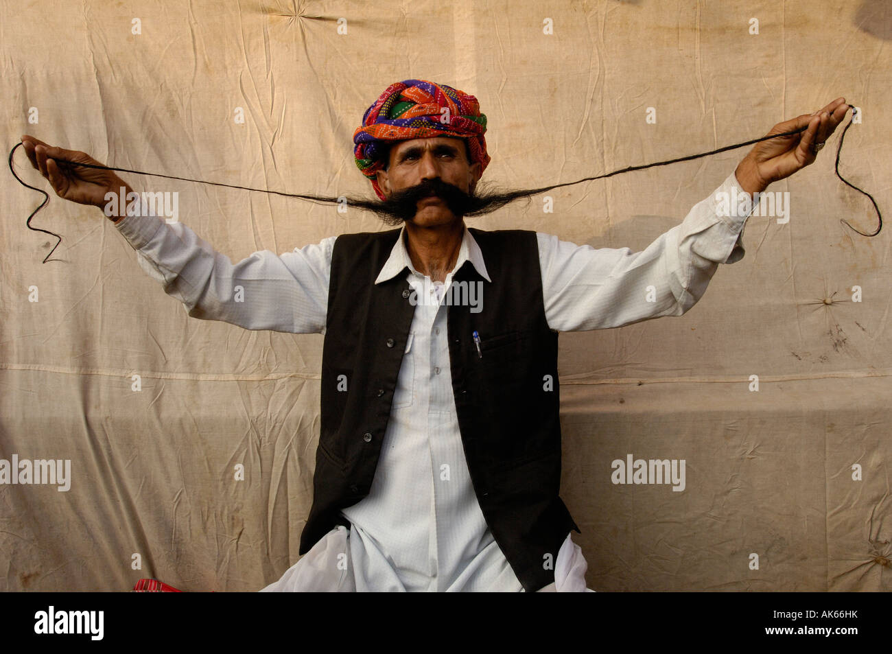 Rajasthani man showing off his long moustache. Pushkar, Rajasthan