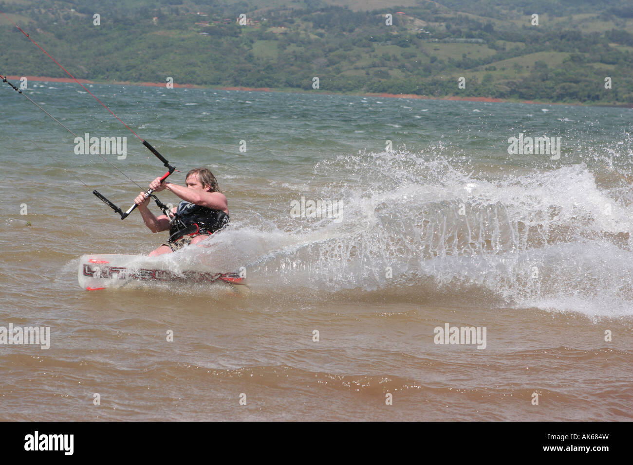 Kite boarding in Costa Rica lake Arenal Stock Photo Alamy