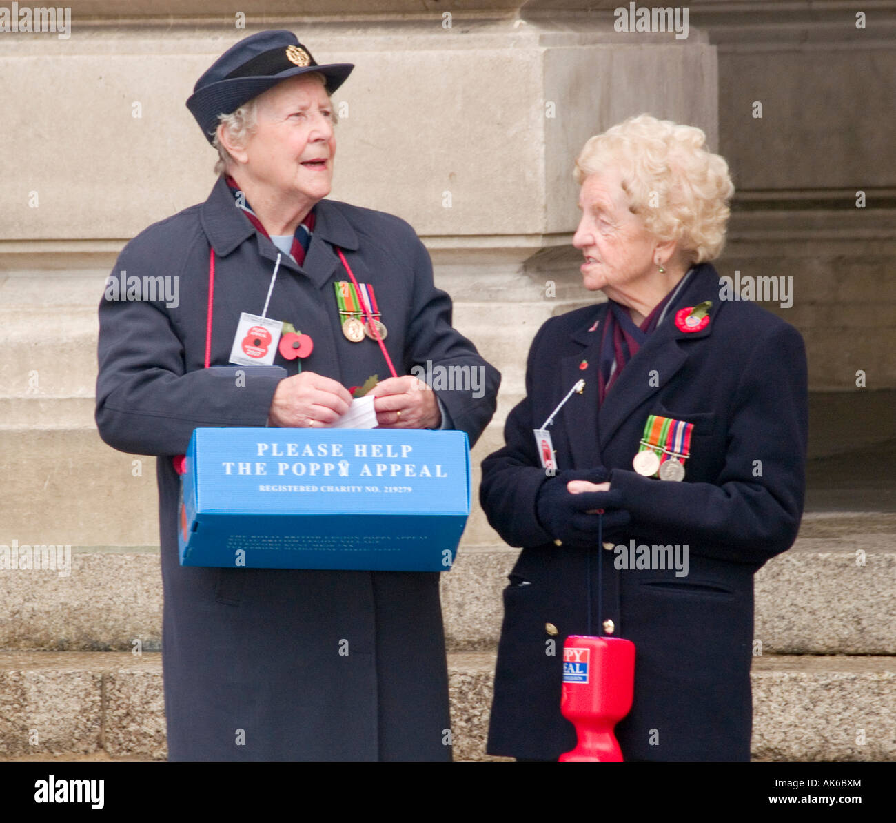 Two ladies collecting for the Poppy Appeal in front of the Council House in the Market Square, Nottingham City Centre UK Stock Photo