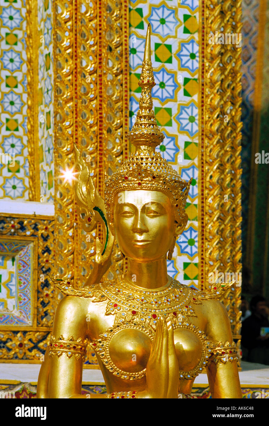 Royal Grand palace Bangkok Thailand - A mythical woman/lion creature, an Apsonsi, is one of the beautiful gilded figures at Wat Phra Kaeo Stock Photo