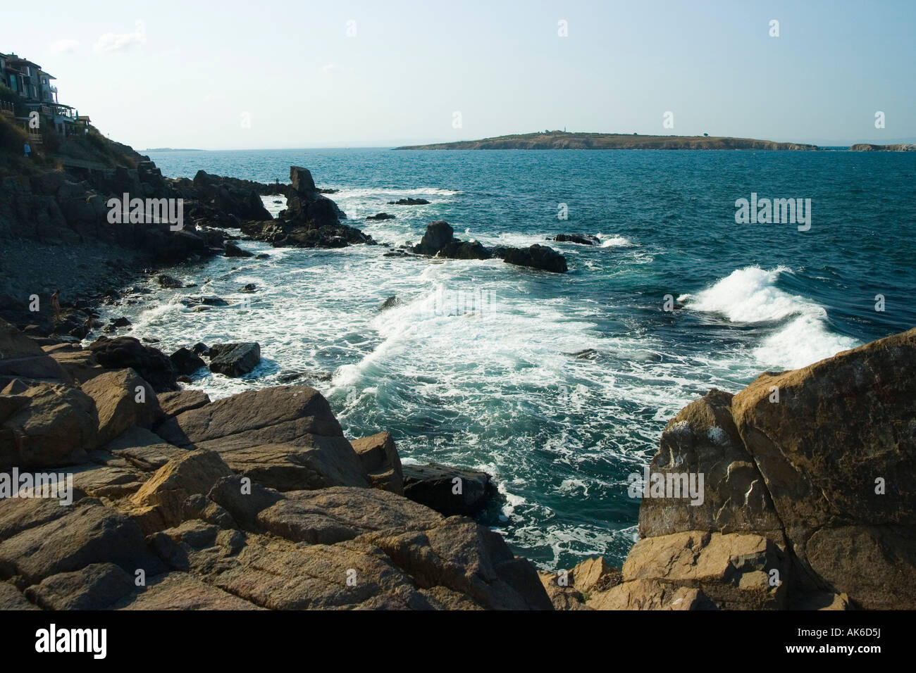 waves splashing onto rocks at sea Stock Photo - Alamy