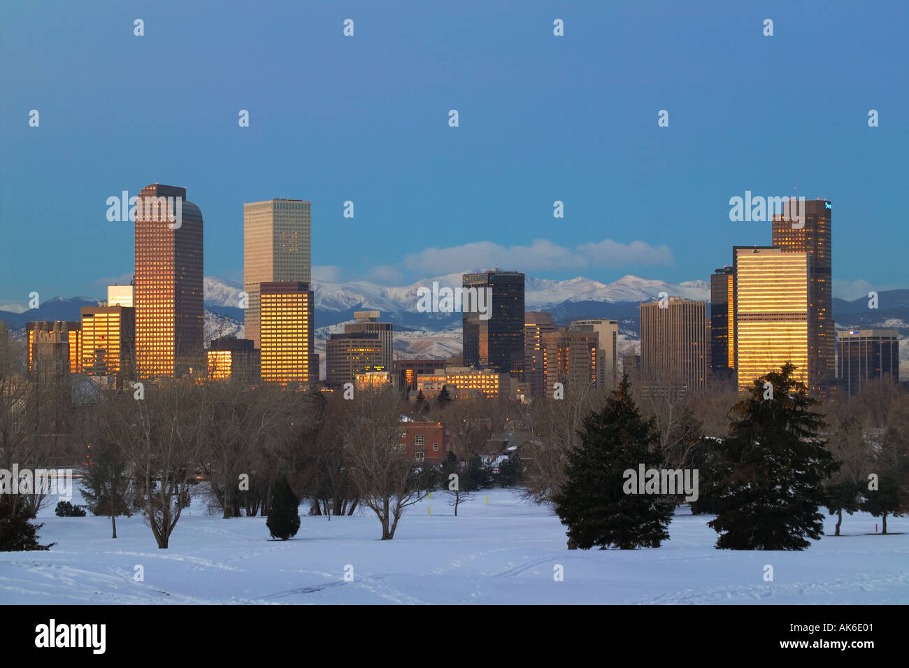 Denver Colorado skyline at sunrise with Rocky Mountains in distance ...