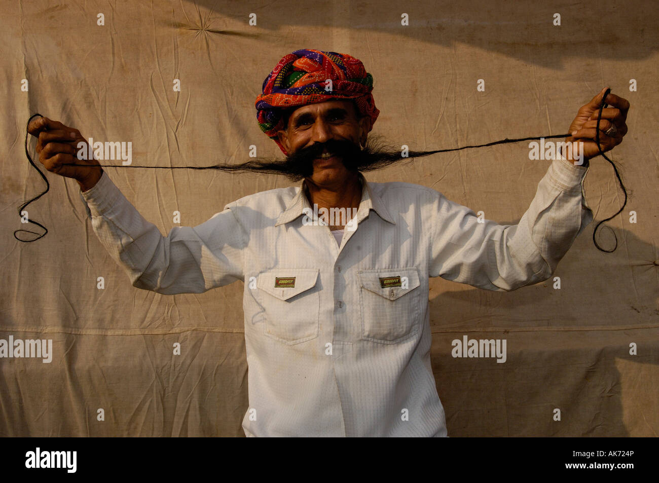 Rajasthani man showing off his long moustache. Pushkar, Rajasthan