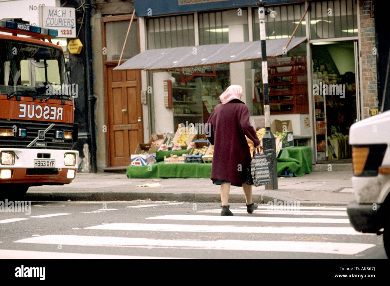 old woman crossing the street Stock Photo - Alamy
