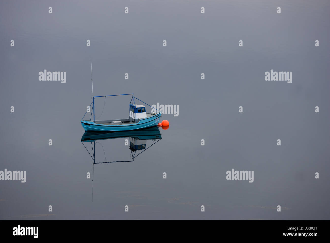 A Fishing boat calmly awaits it's next job Stock Photo Alamy
