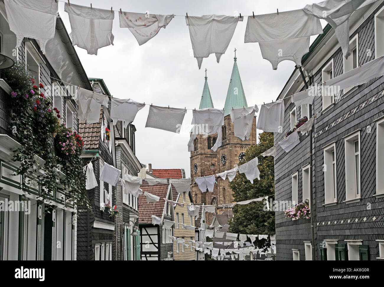 tradional festive day in Schwelm with white laundry hanging in the street, Germany, North Rhine-Westphalia, Ruhr Area, Schwelm Stock Photo
