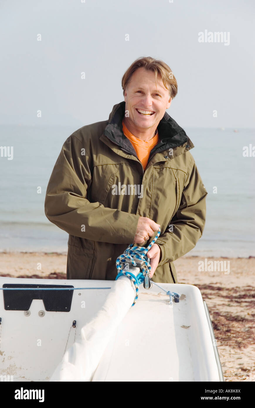 Colour portrait of 43 year old man with sailing boat. Stock Photo