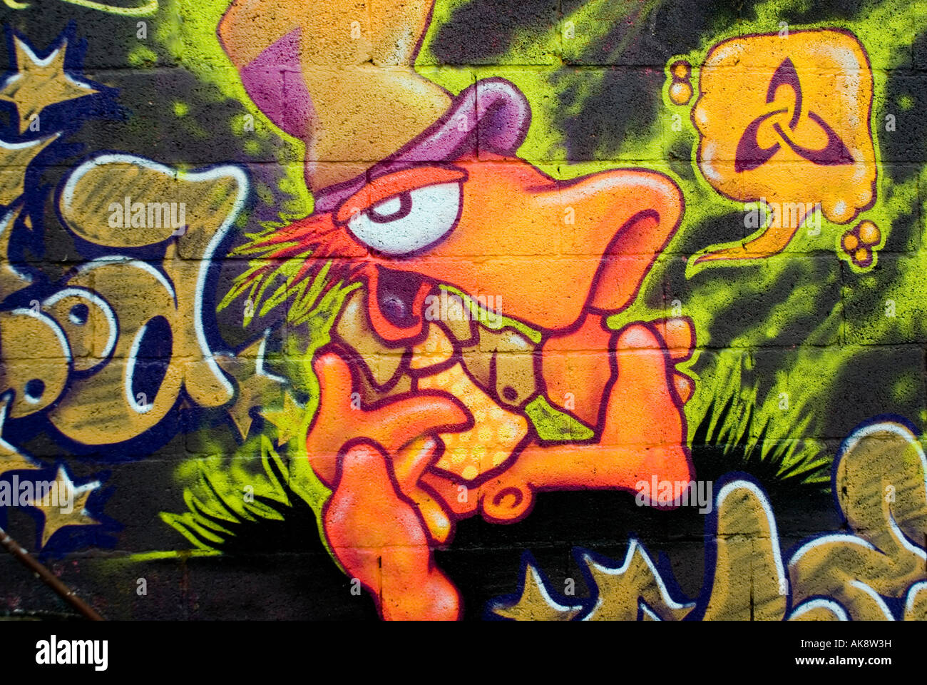Cheerful Happy Smiling Colourful Orange Graffiti Mad Hatter Figure 272A Leopold Street Cowley Road Oxford England UK 2006 NR Stock Photo