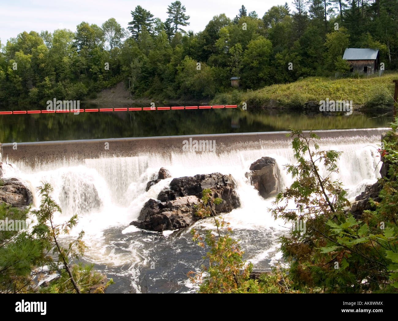 The spectacular waterfall and slide masters cabin on the Coulonge River, at Chutes Colounge Park in Mansfield Quebec, Canada Stock Photo