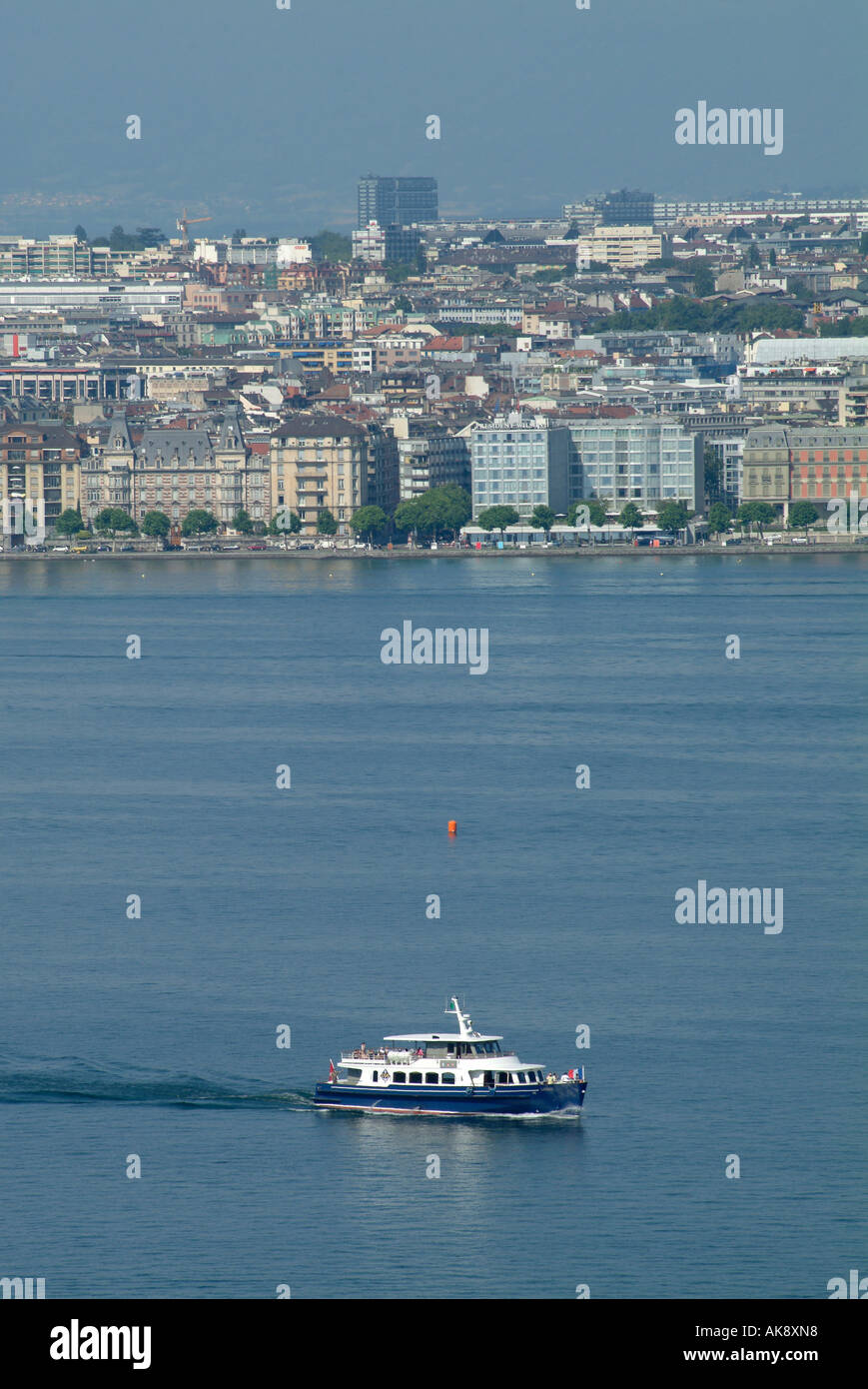 Geneva. Boat on Lake Geneva with skyline of the city of Geneva. Rive droite. Quai Wilson. Stock Photo