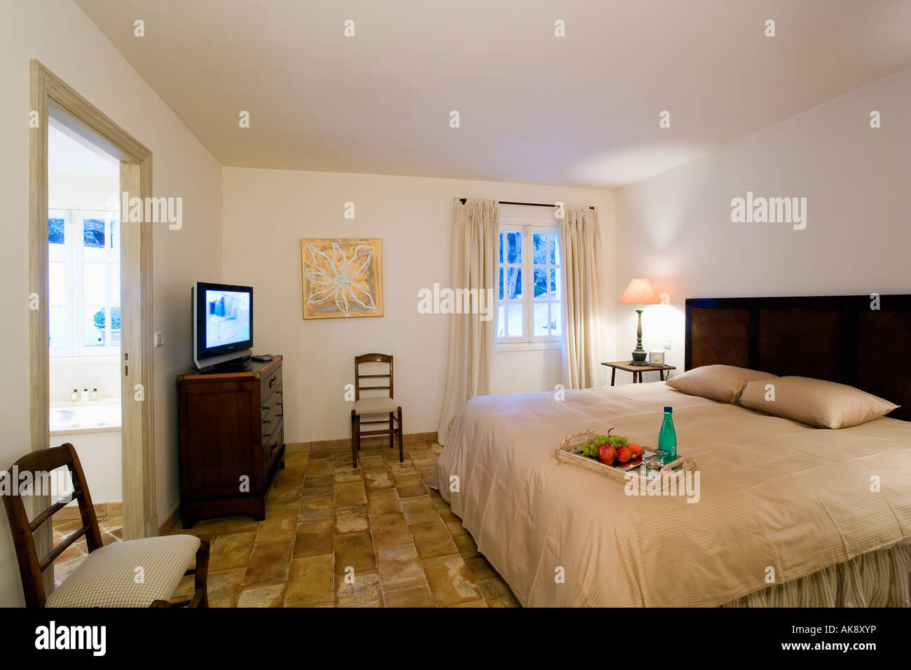 Rough Stone Floor Tiles In Modern French Seaside Bedroom With Cream Stock Photo Alamy