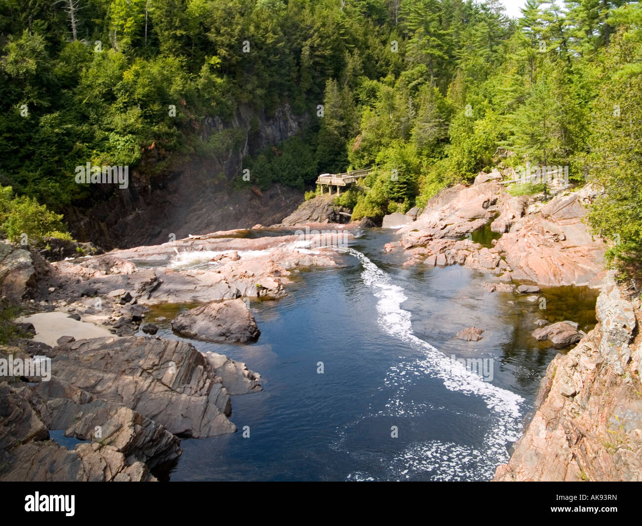 A waterfall going down over the rocks into the canyon at the Chutes Coulonge Park in Mansfield, Quebec Canada Stock Photo