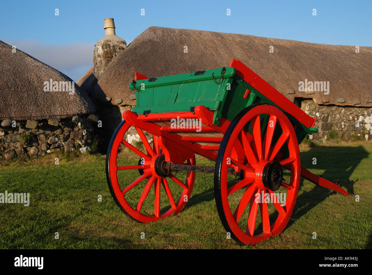 Traditional wagon and houses with stroh roofs, Museum of Rural Life, Kilmuir, Island of Skye, Inner Hebrides, Scotland Stock Photo