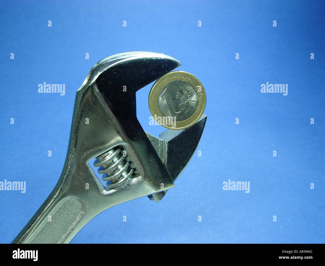 Euro in a wrench as symbol for exchange rate fluctuations in the currency Stock Photo