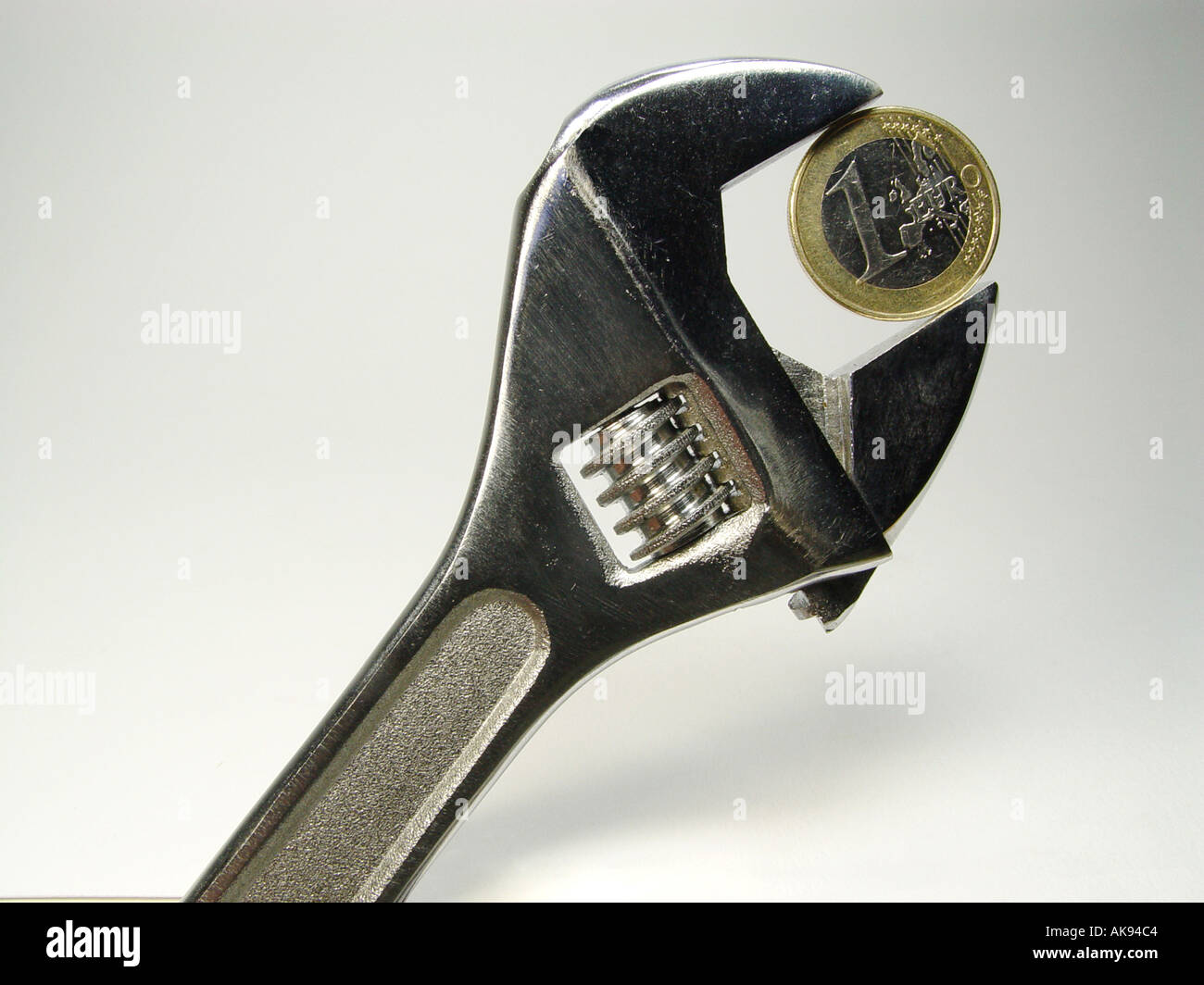 Euro in a wrench as symbol for exchange rate fluctuations in the currency Stock Photo