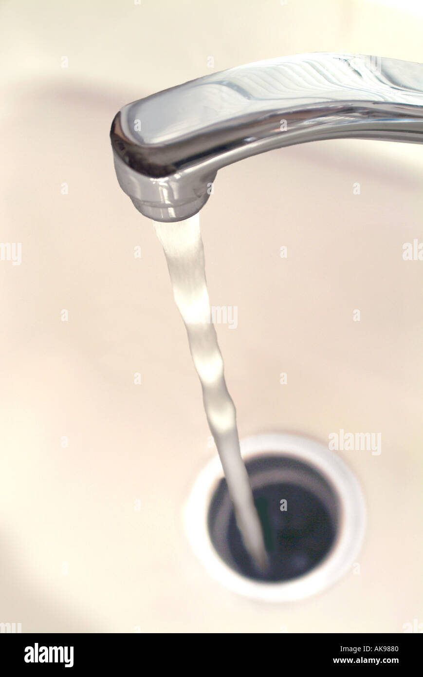 Close up of stream of water and faucet Stock Photo