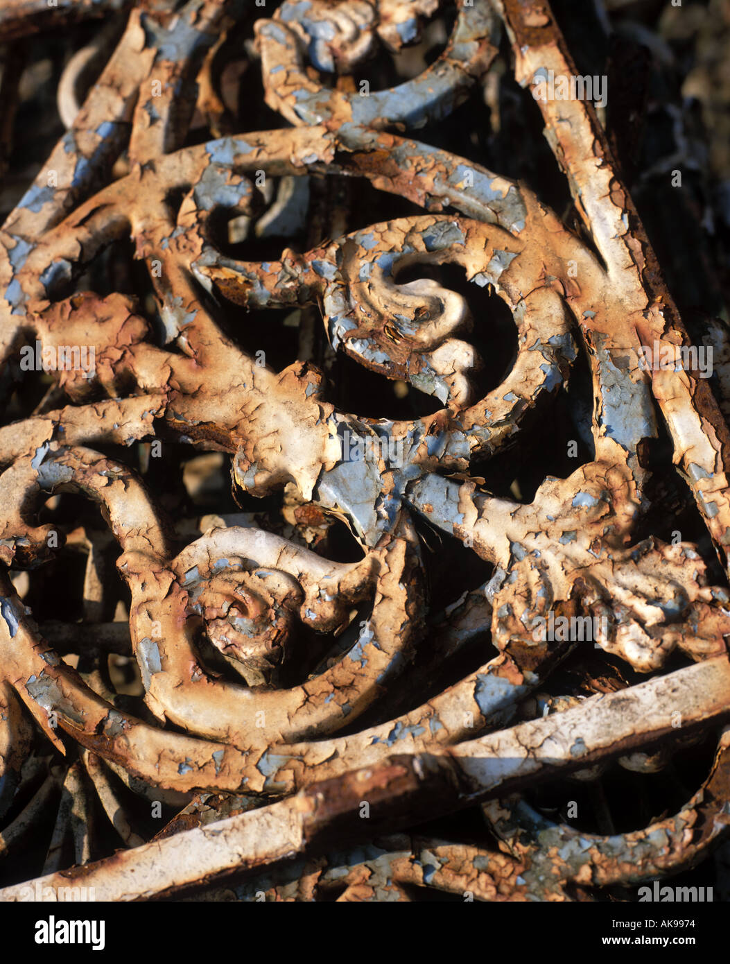 Old decorative ironwork with peeling paint Stock Photo