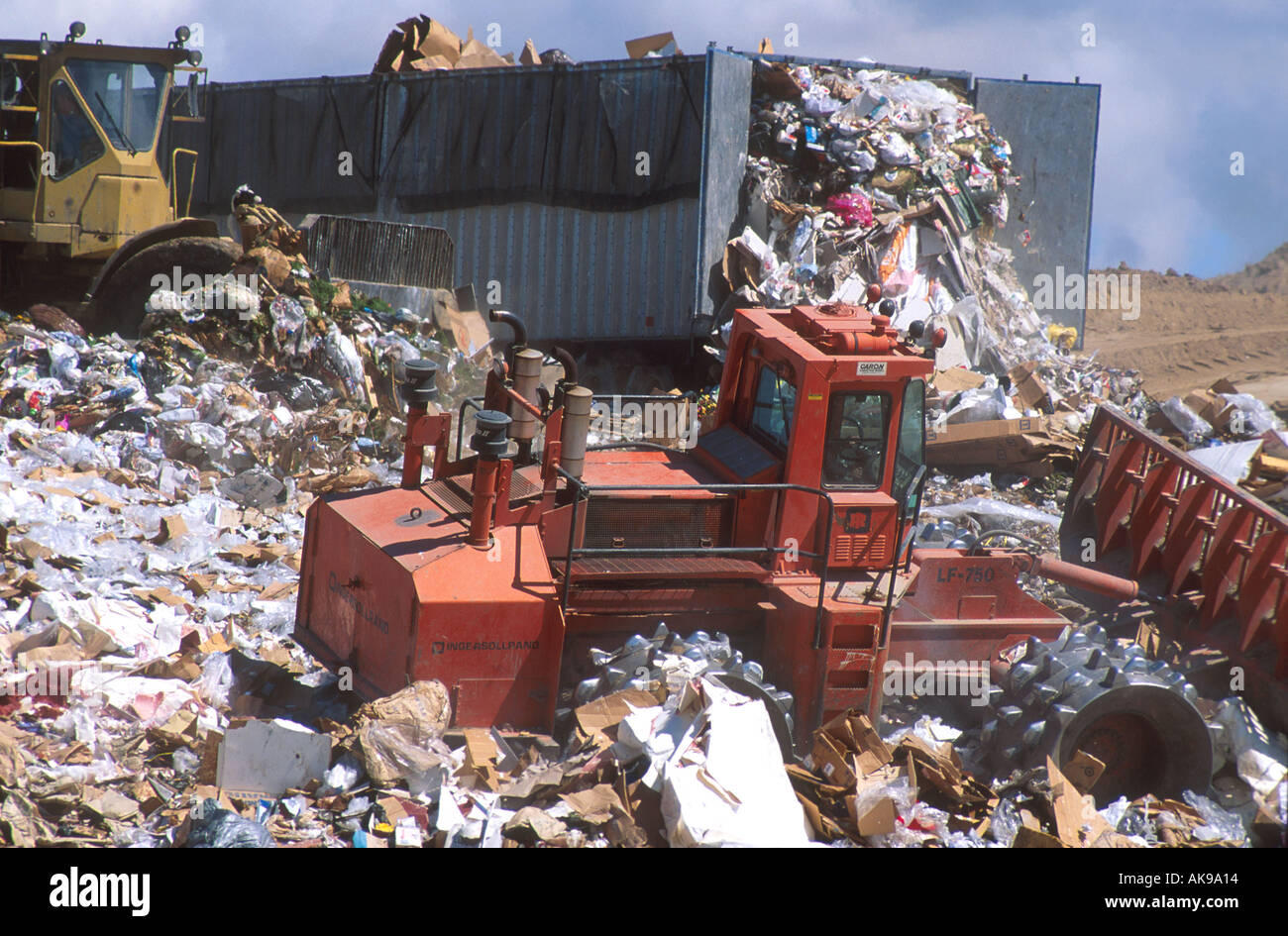 Sanitary landfill with compactors at work Stock Photo Alamy