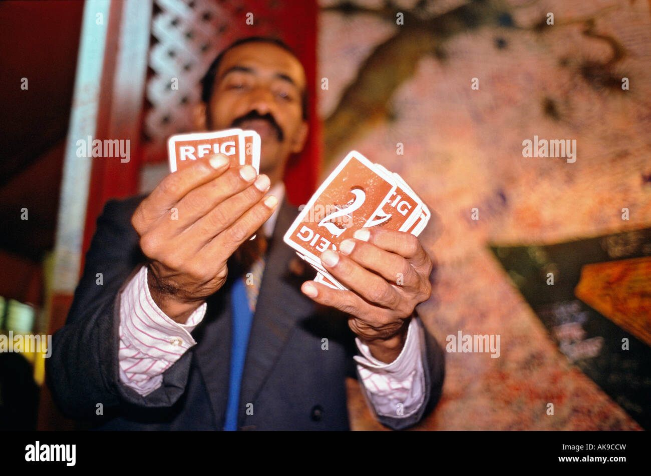 Chinese Cuban magician entertains with card tricks at a restaurant in the Barrio Chino Havana Cuba s Chinatown Stock Photo