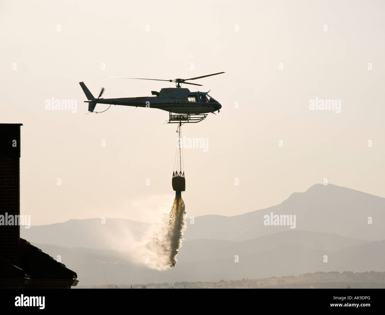 fire fighter helicopter carrying water Stock Photo Alamy