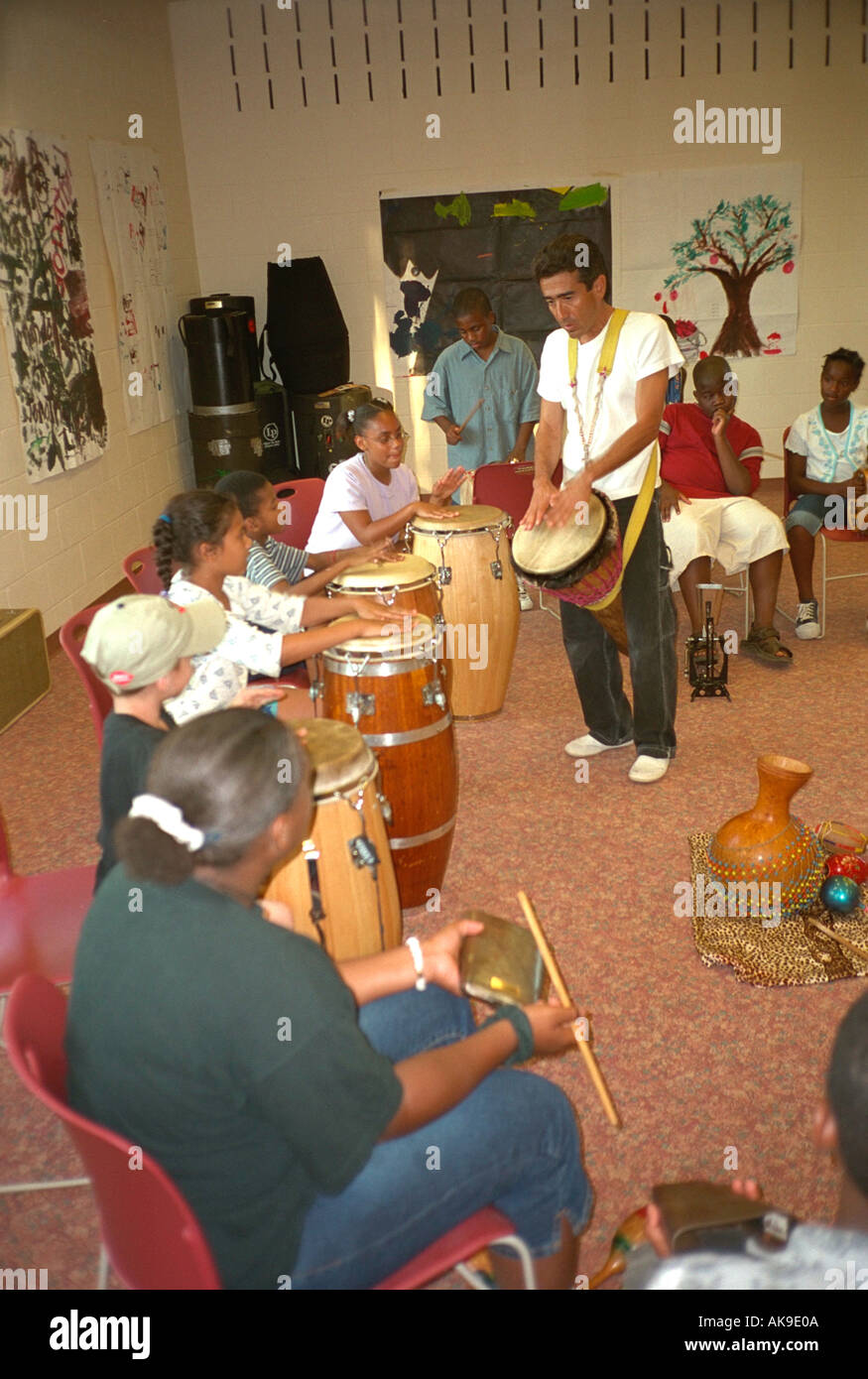 Youth Express 10th anniversary drummers age 11  with Minneapolis Drum School teacher. St Paul Minnesota USA Stock Photo