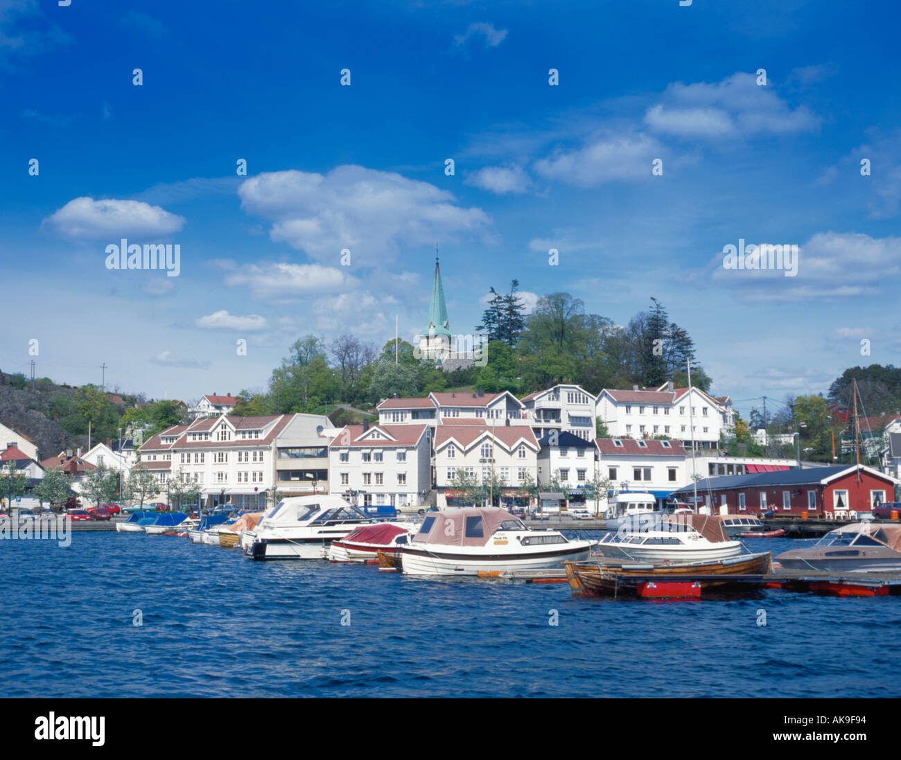 View Over Boats And Harbour To Picturesque Village Of Grimstad Stock Photo Alamy