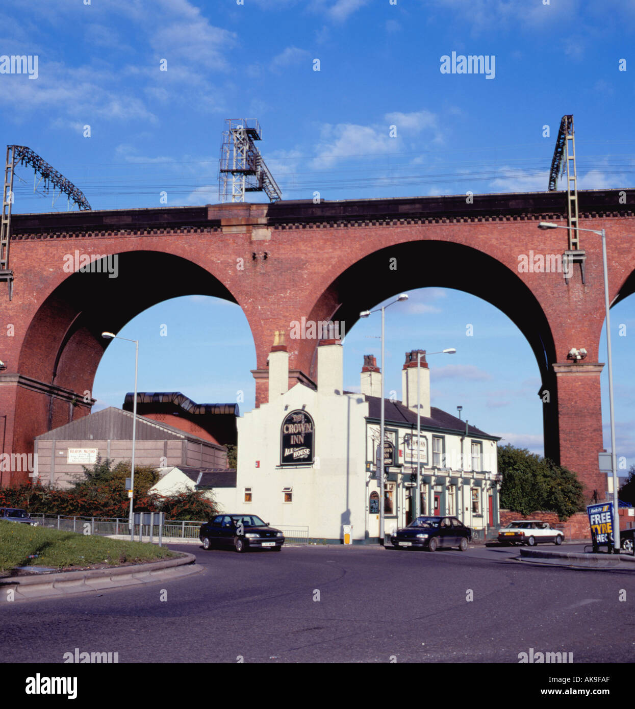 The 'Crown Inn' beneath Mersey Railway Viaduct, Stockport, Greater Manchester, England, UK. Stock Photo