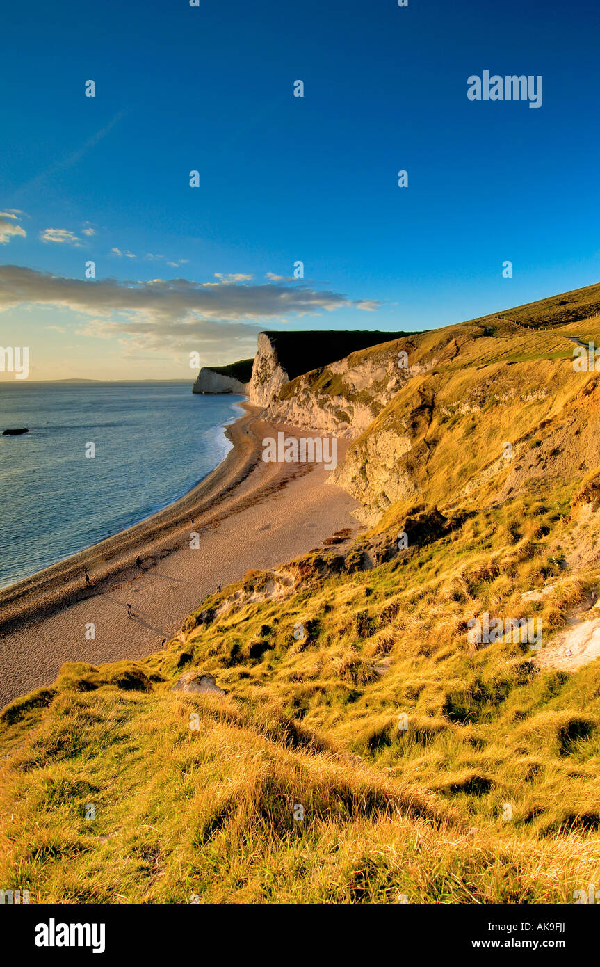 Just before sunset on the Dorset coast looking West from Durdle Door towards Swyre head and Bats Head Stock Photo