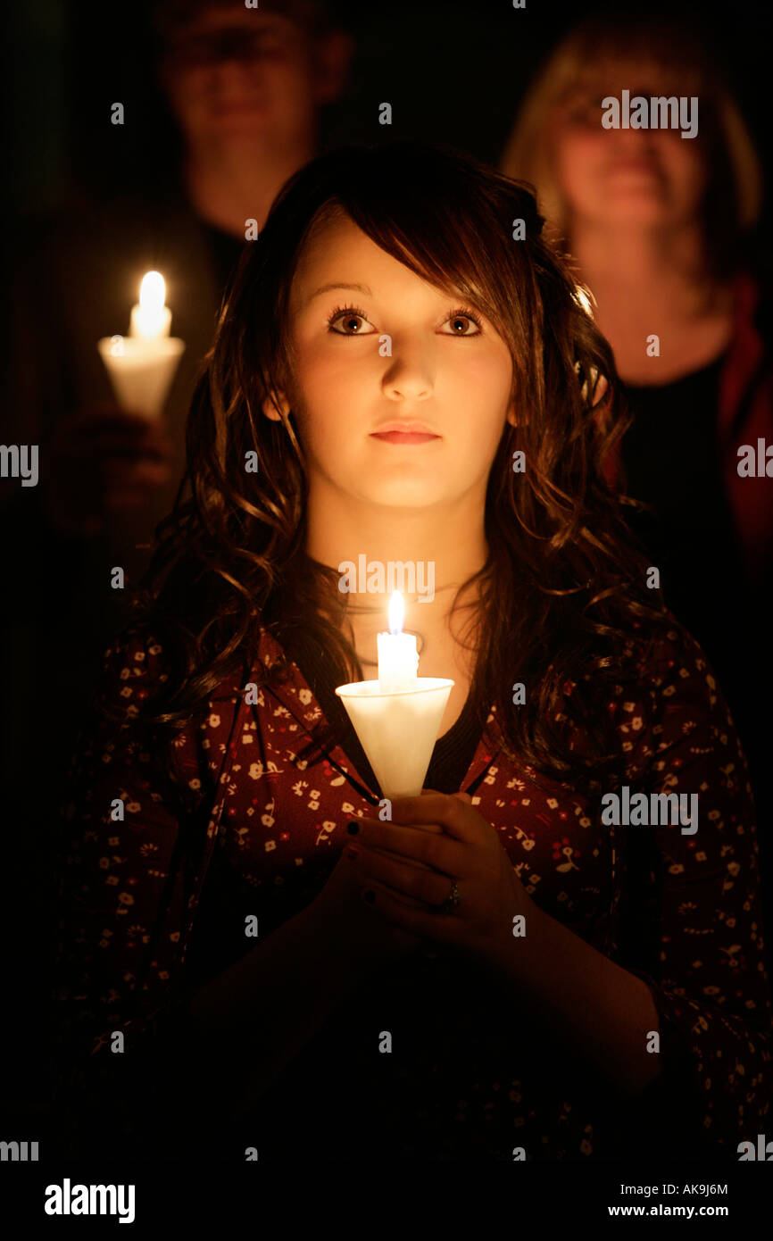 Teen girl at candle light ceremony Stock Photo Alamy