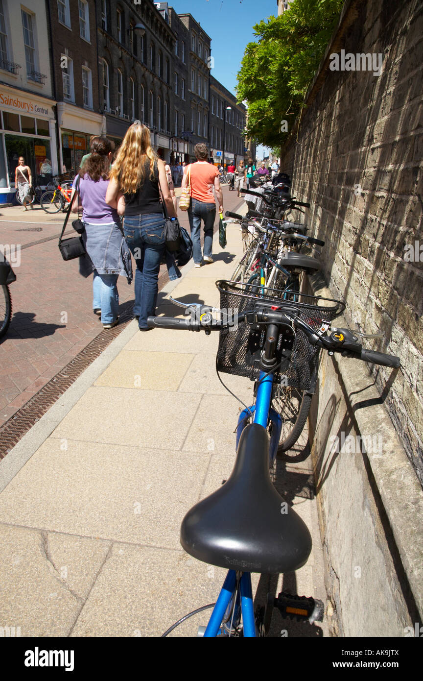 Bicycles parked along busy street in Cambridge, UK Stock Photo