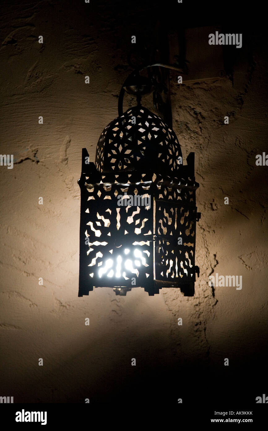 Moroccan Arabic metalwork lantern at night. Marrakesh Morocco. Stock Photo