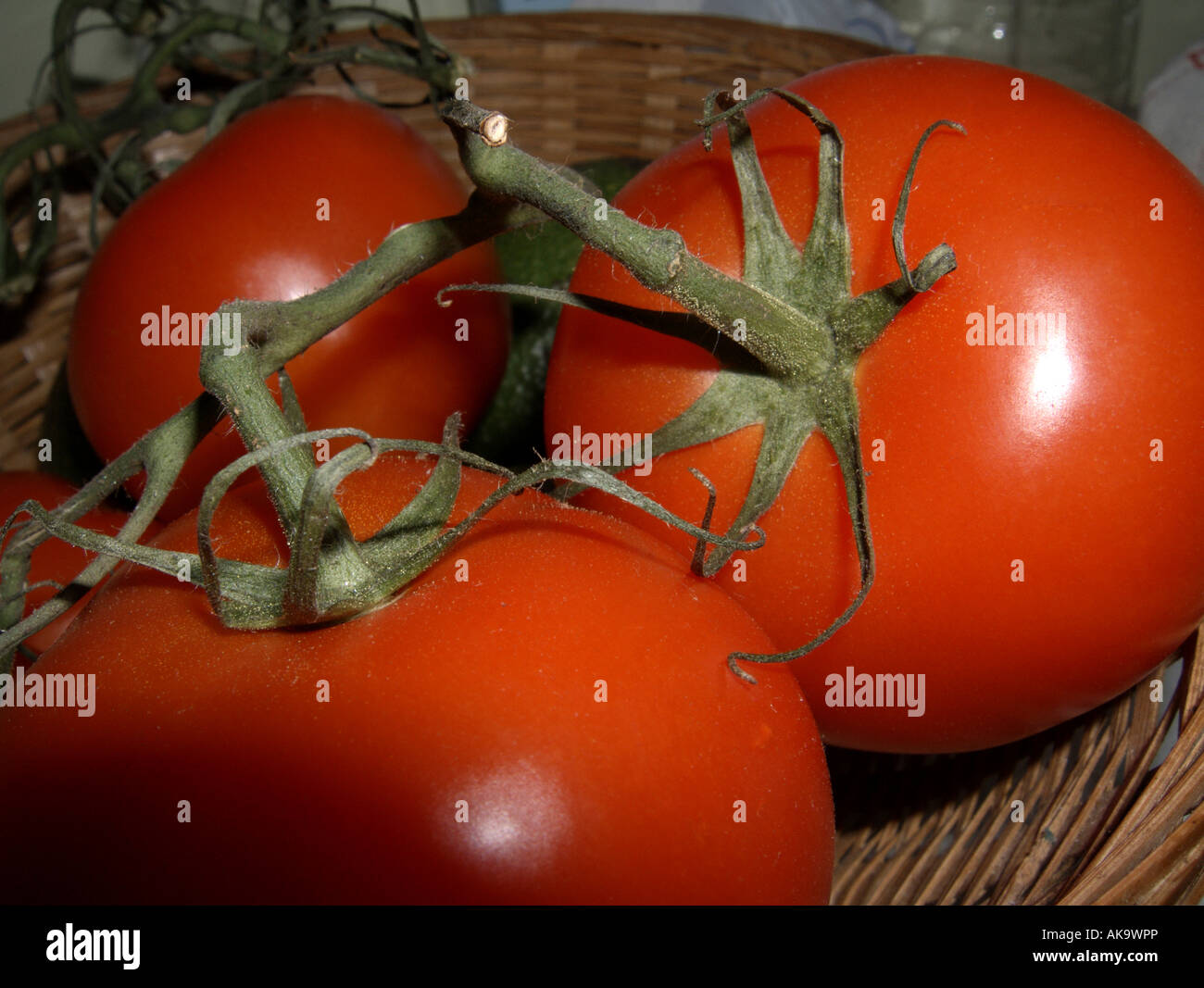Close up of tomatoes in a basket Stock Photo - Alamy