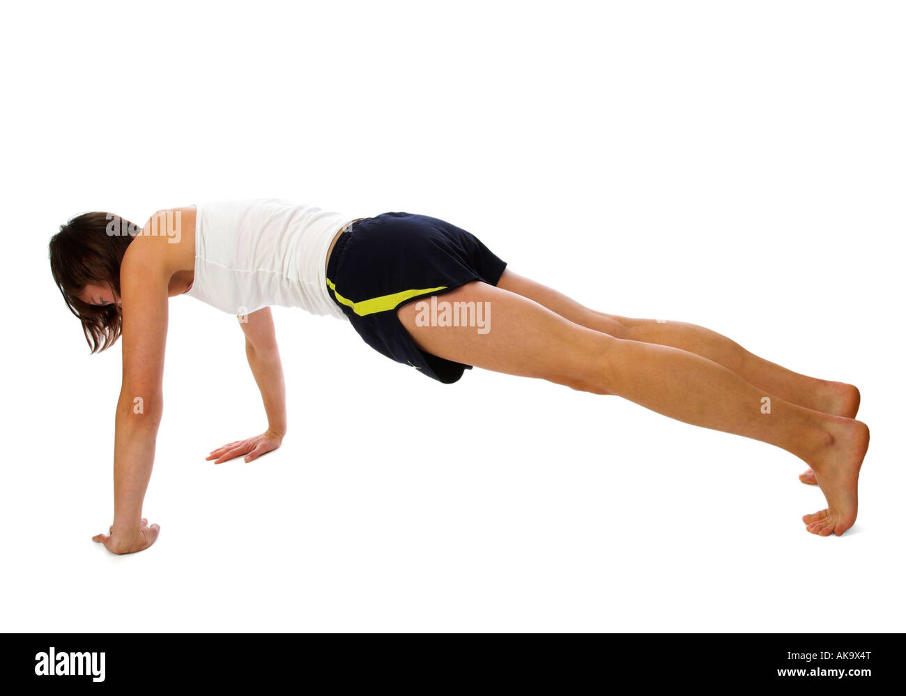 A young woman doing press-ups Stock Photo