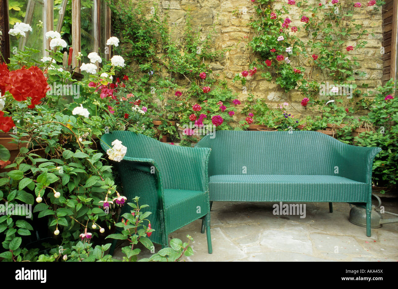 Lloyd Loom chairs in conservatory garden room Stock Photo Alamy