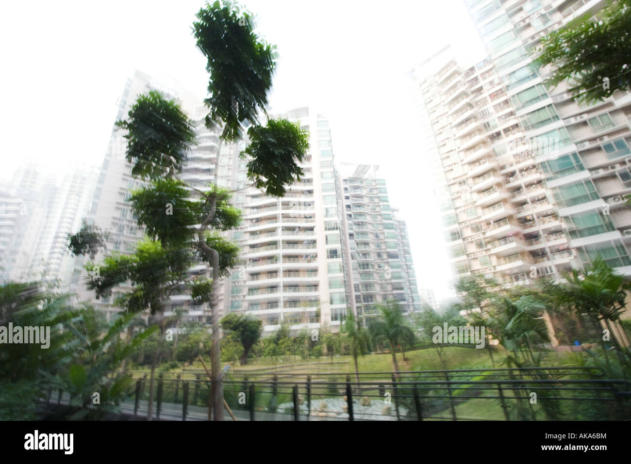 China, Guangdong Province, Guangzhou, high rise apartments and park
