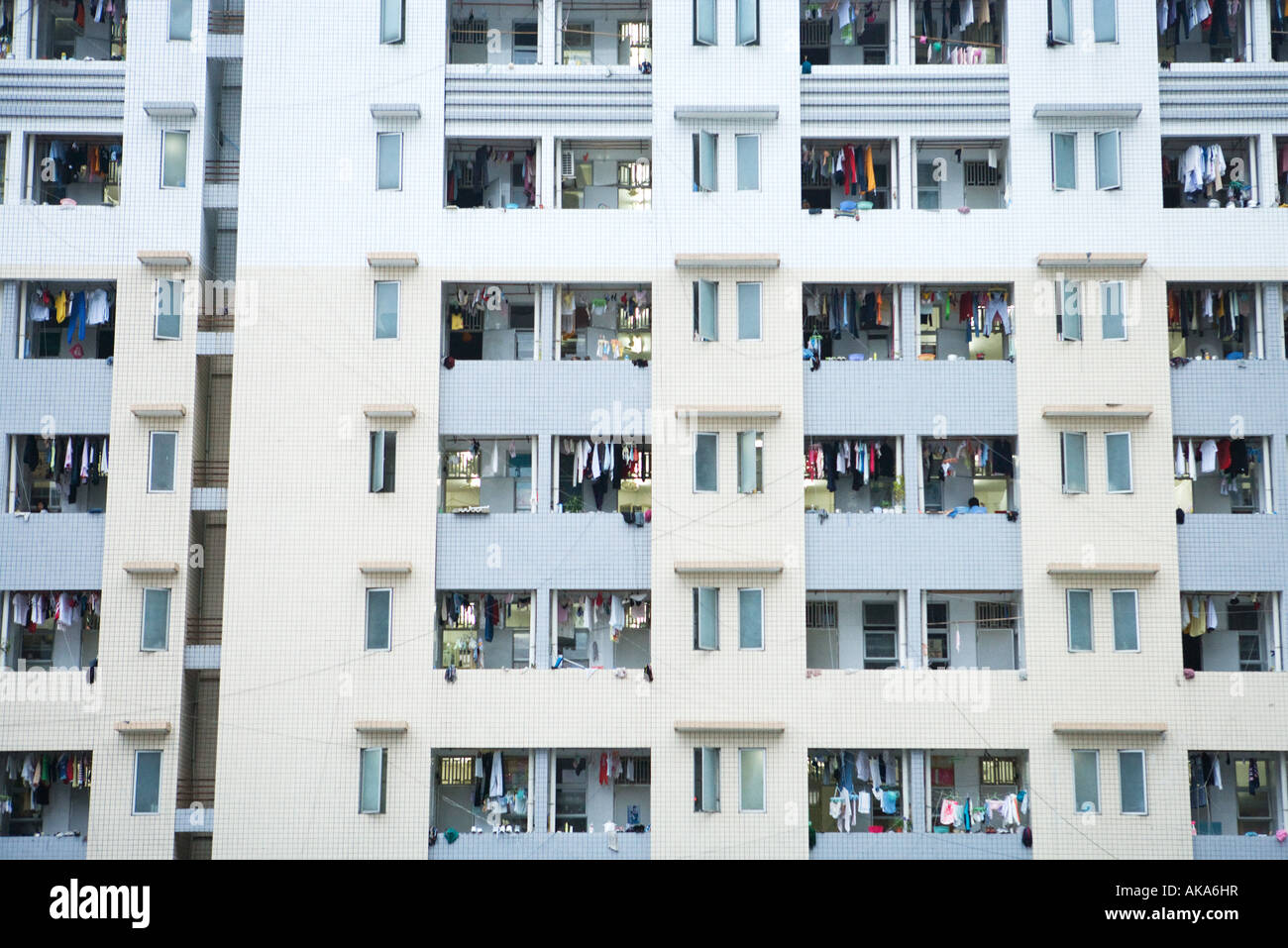 High rise apartment building, laundy hanging out to dry on balconies Stock Photo