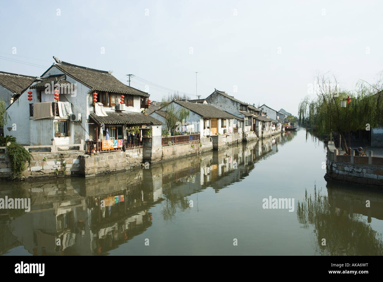 China, Guangdong Province, houses along canal Stock Photo