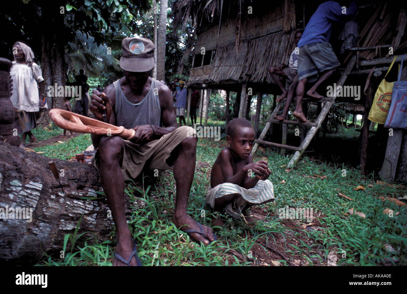 Wood carver in Sepik River Papua New Guinea Stock Photo - Alamy