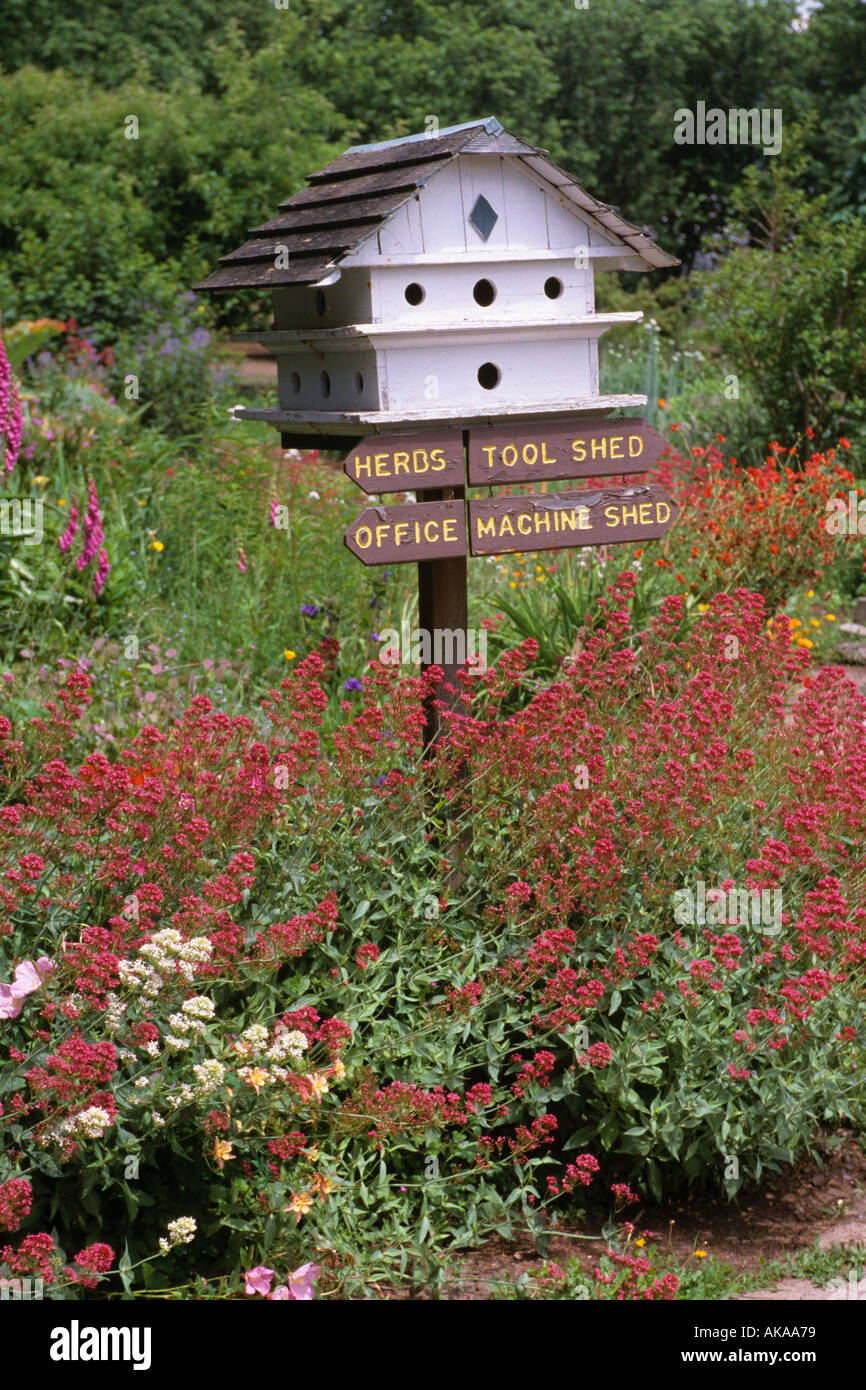 Birdhouse in garden with signs Stock Photo