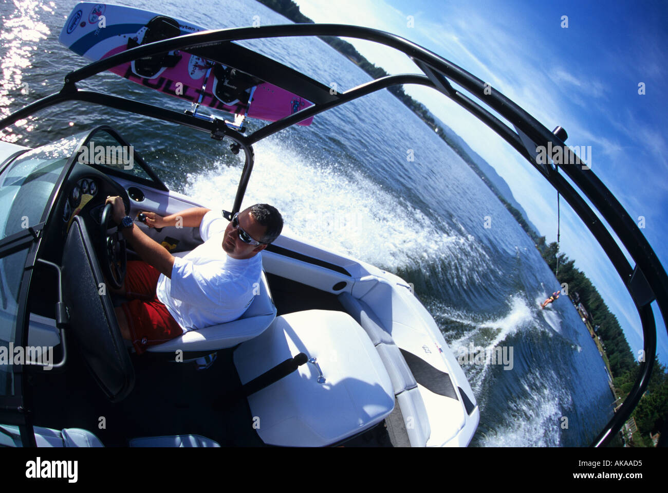 man driving a wakeboard boat Stock Photo Alamy