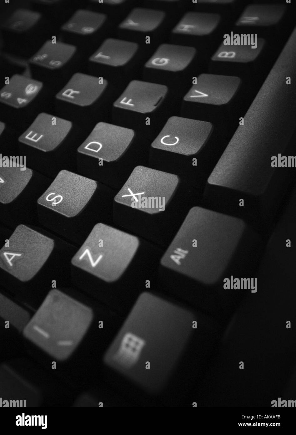 qwerty keyboard computer IT infomation technolgy PC IBM type write input data entry typing repetitive strain office injury claim Stock Photo