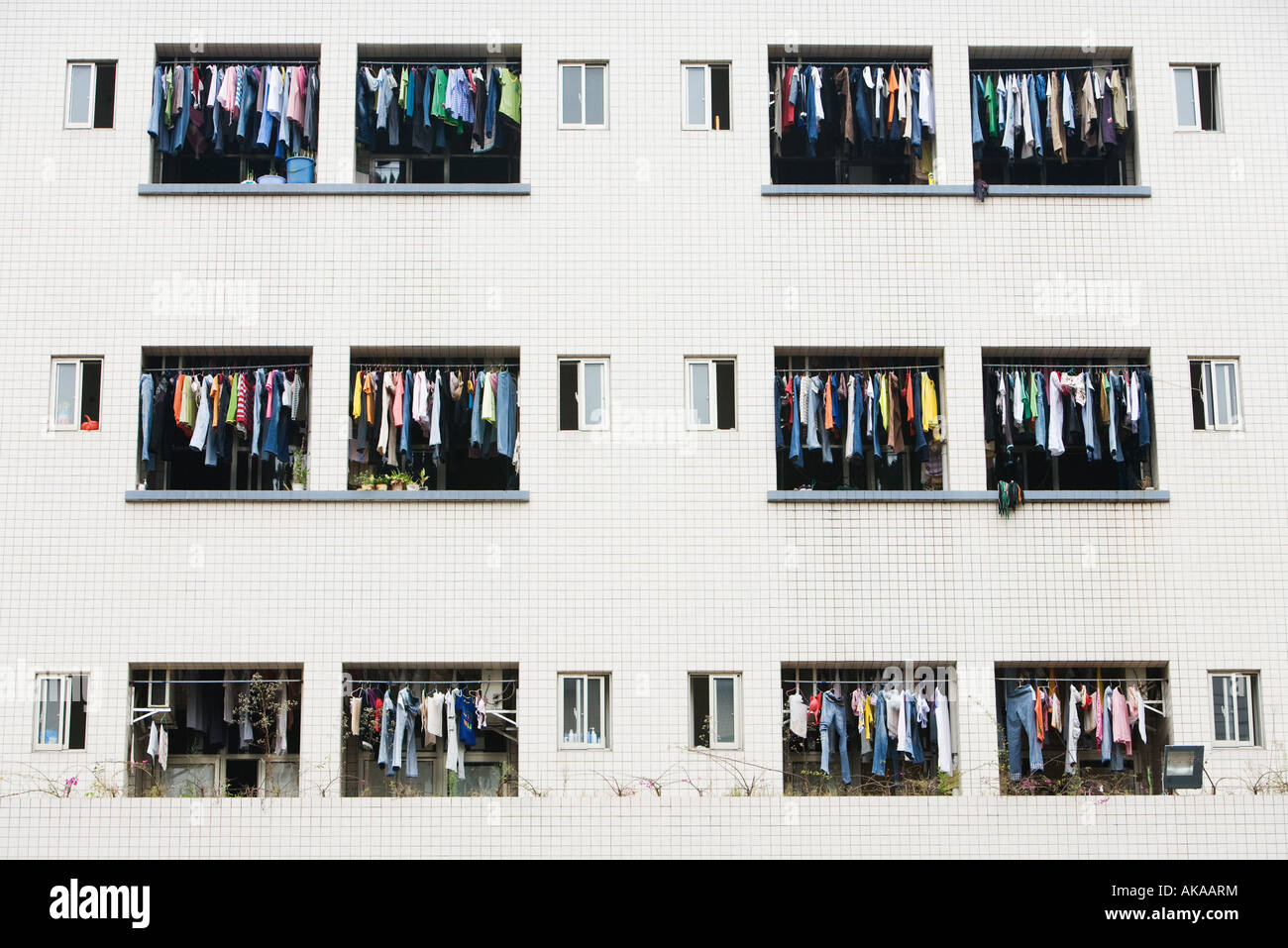 Laundry hanging to dry in balconies of apartment building Stock Photo