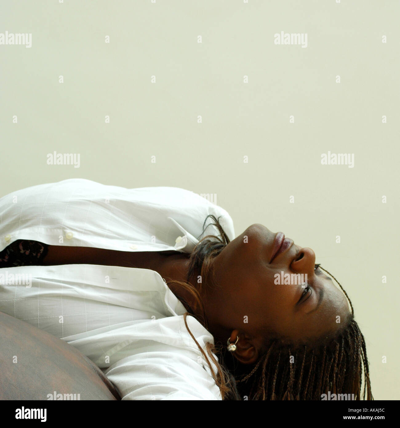 Happy Black Woman reclining Stock Photo Alamy