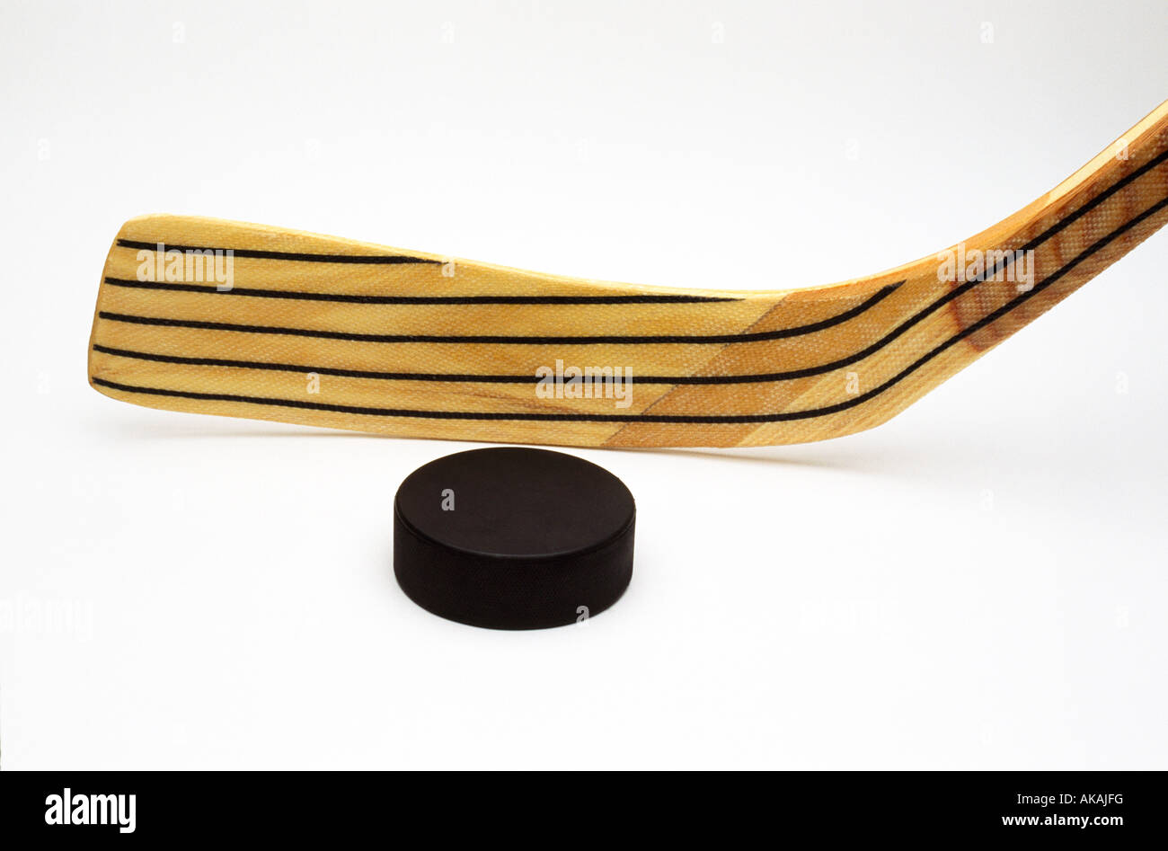Hockey stick and puck Stock Photo Alamy