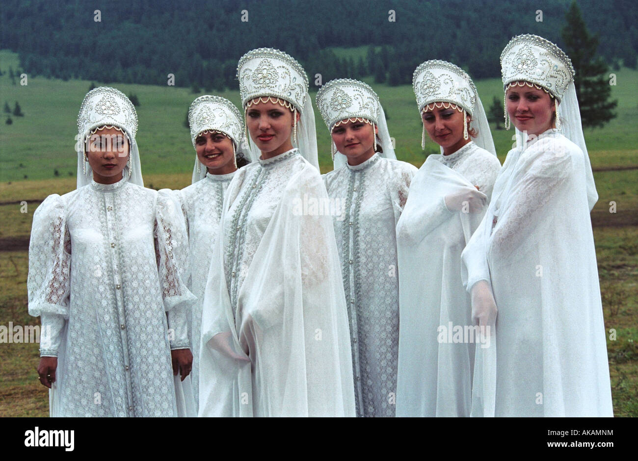 Portrait of young girls in Russian native raiment.   El-Oiyn - national festival of Altaic people. Russia Stock Photo